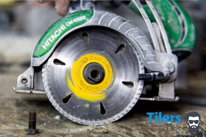 tile saw blade nearly removed from the spindle